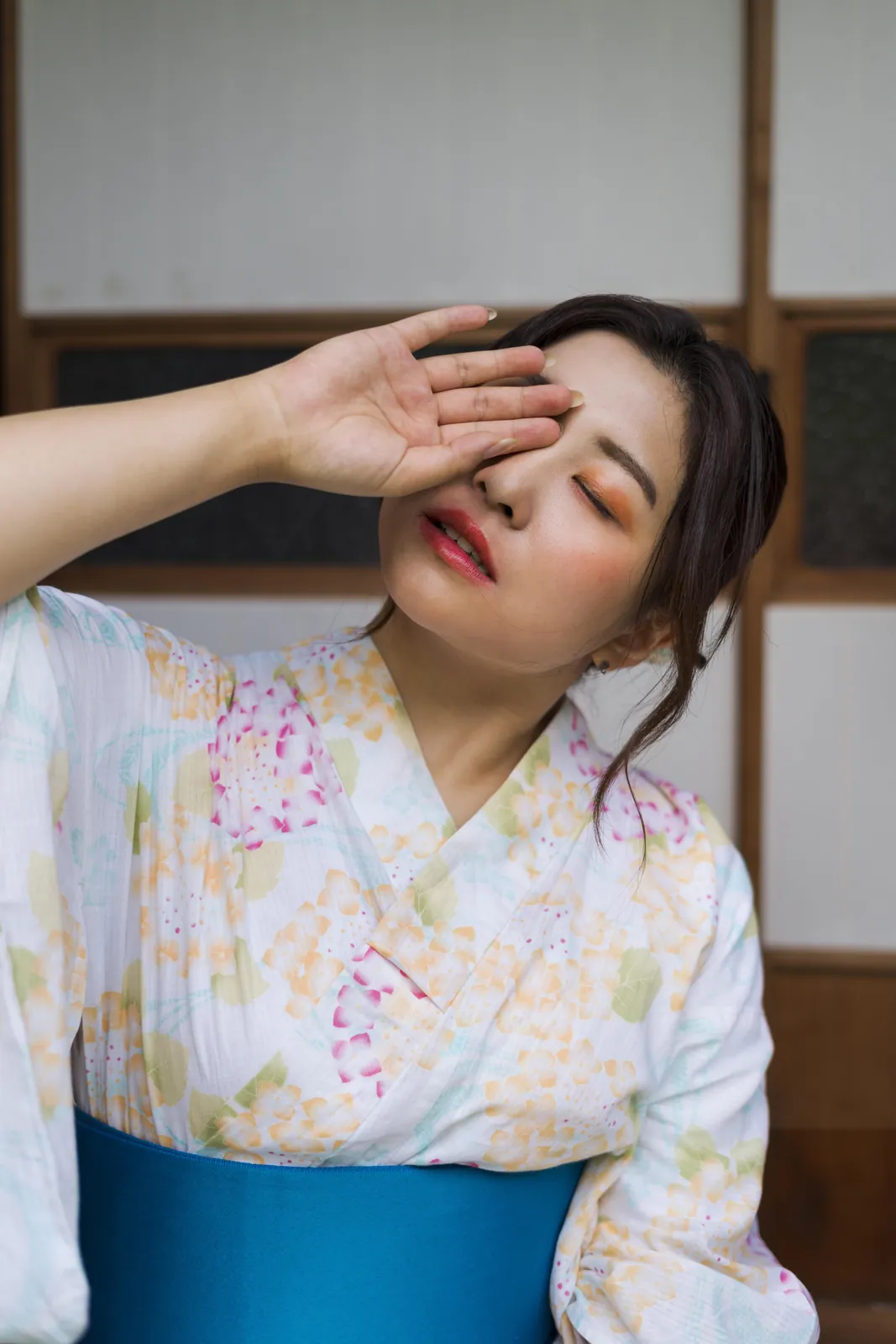 A woman pausing with her eyes closed